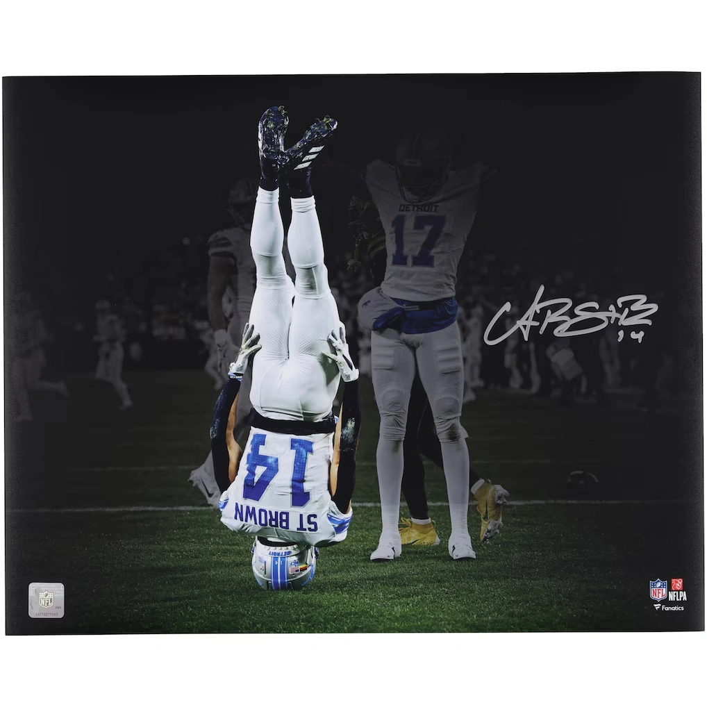 Amon-Ra St. Brown Detroit Lions Autographed Fanatics Authentic 16" x 20" Head Stand Celebration Spotlight Photograph